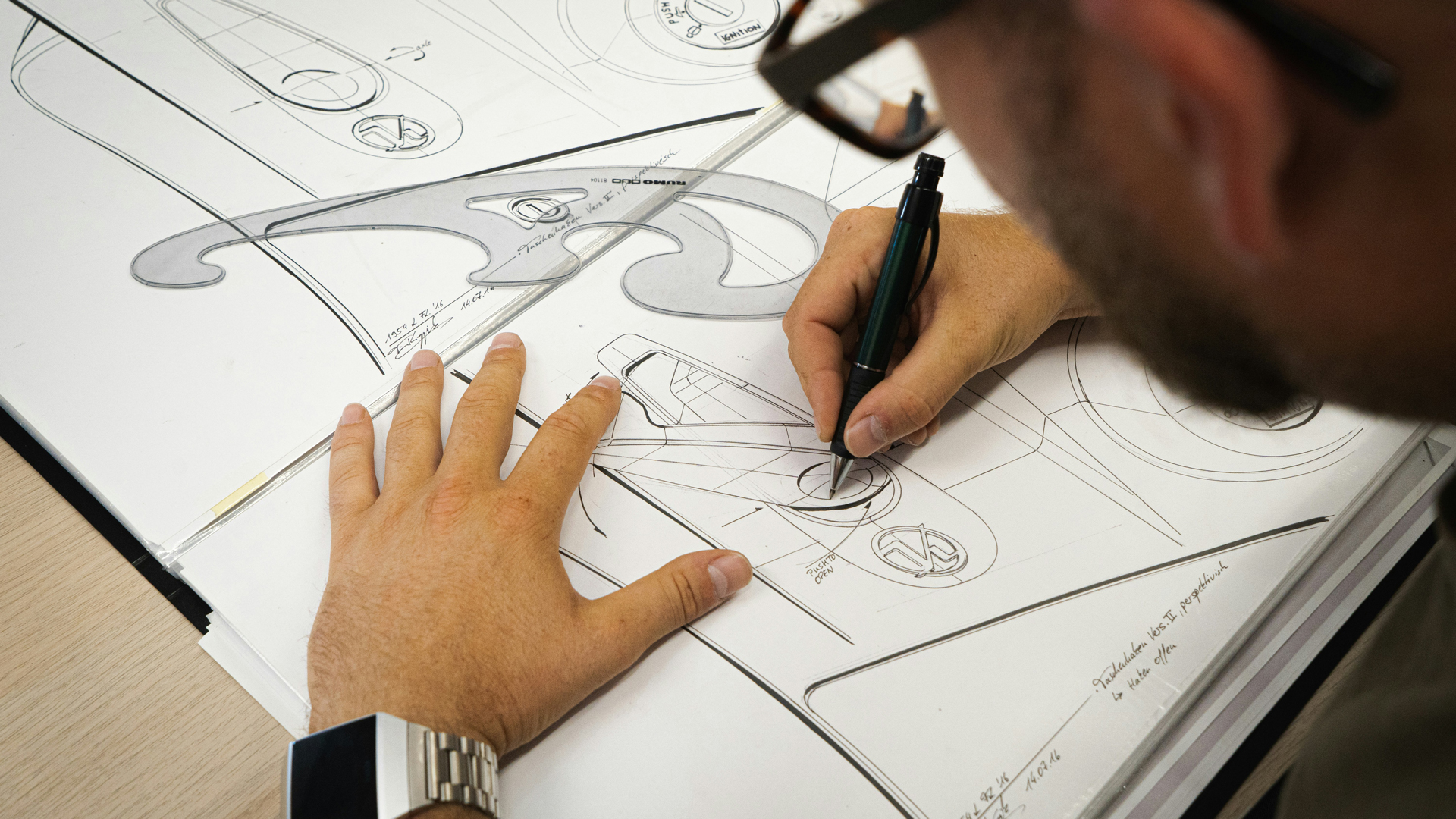 Photograph of someone drawing.