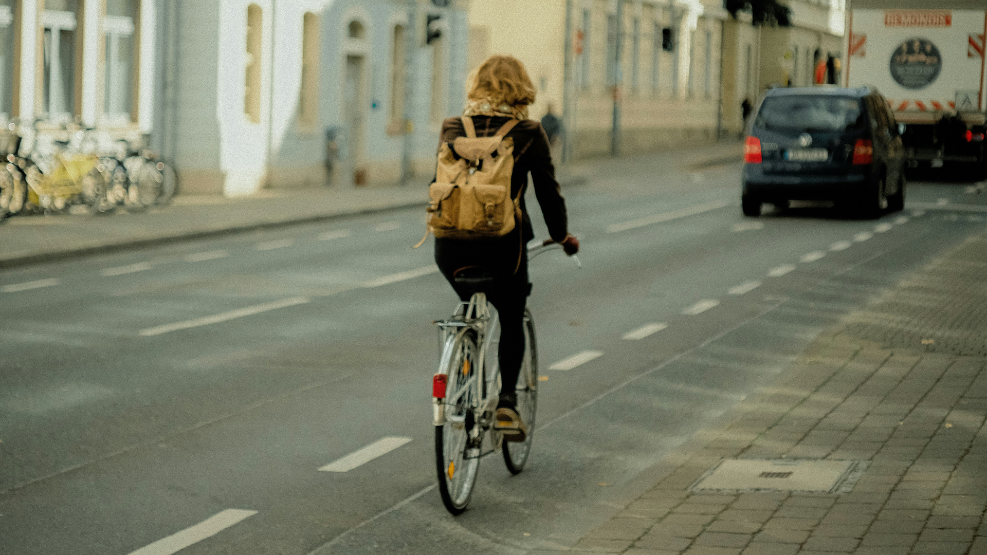Photograph of someone riding a bike.