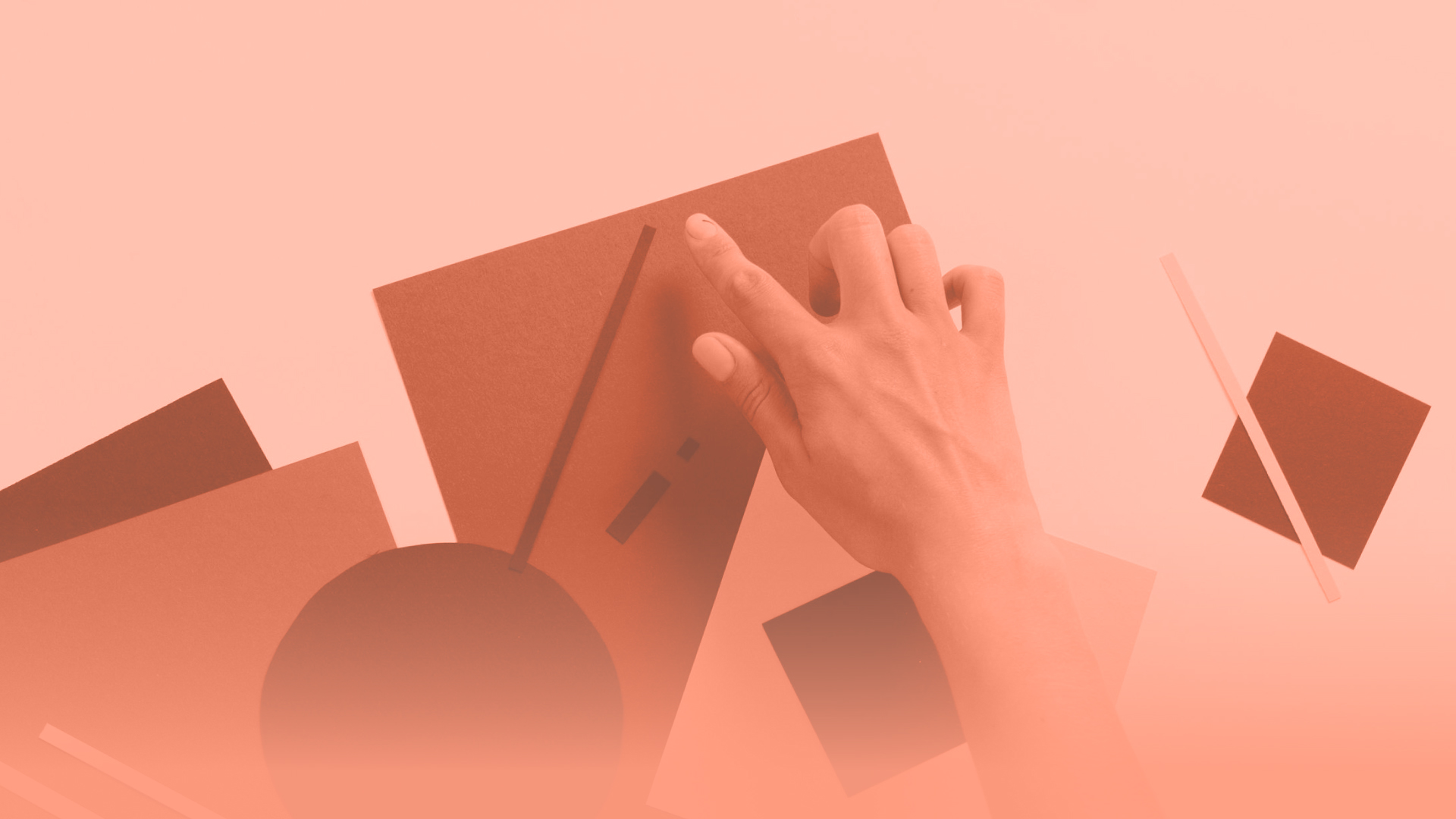 Creative workspace scene showing someone organising abstract shapes for a design or craft project.Creative workspace scene showing someone organising abstract shapes for a design or craft project.