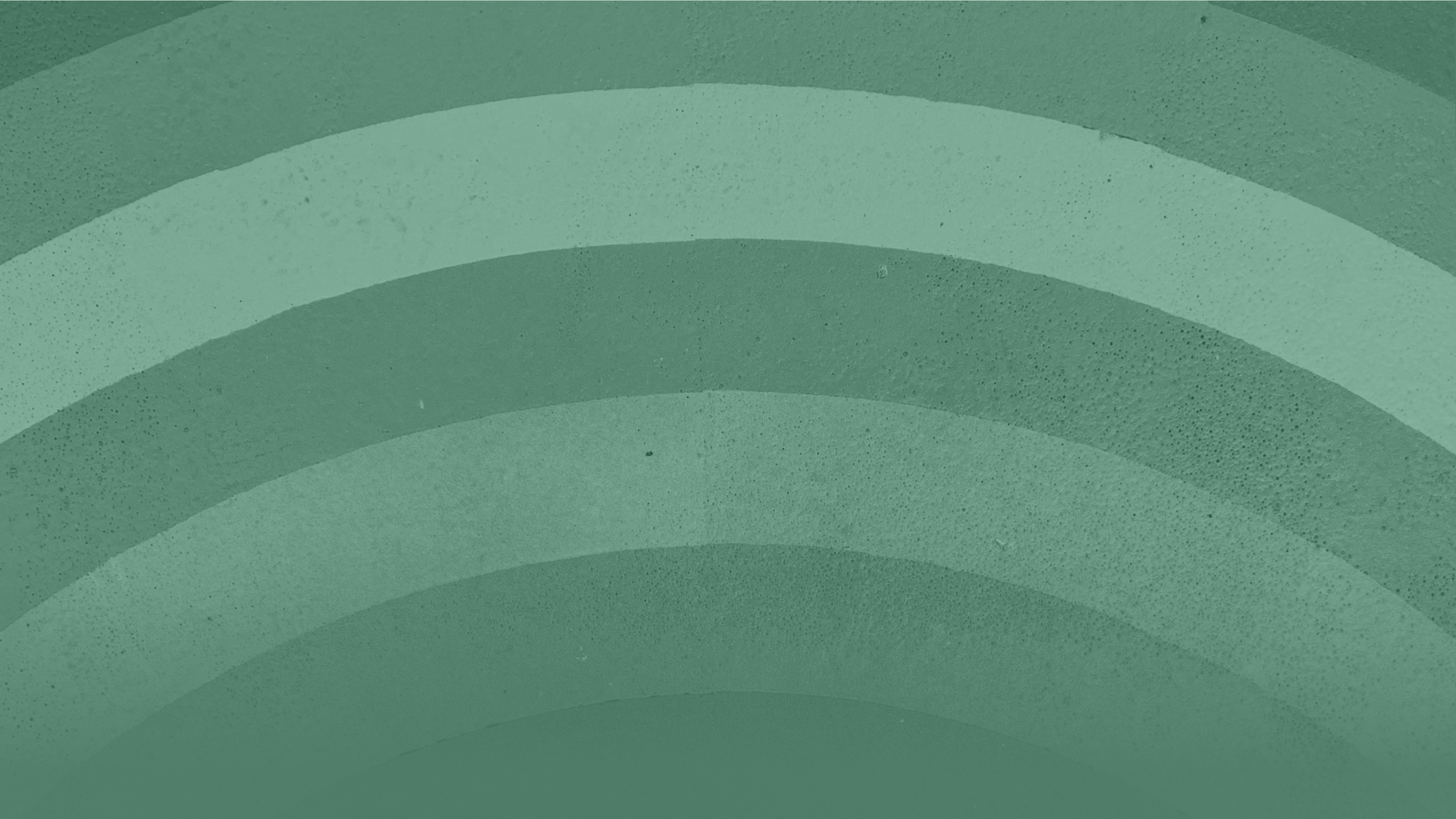 Abstract image of a rainbow, all tinted green.