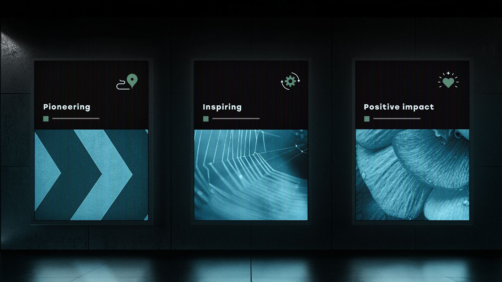 An image of back lit underground advertising hoardings that depict visual identity work.