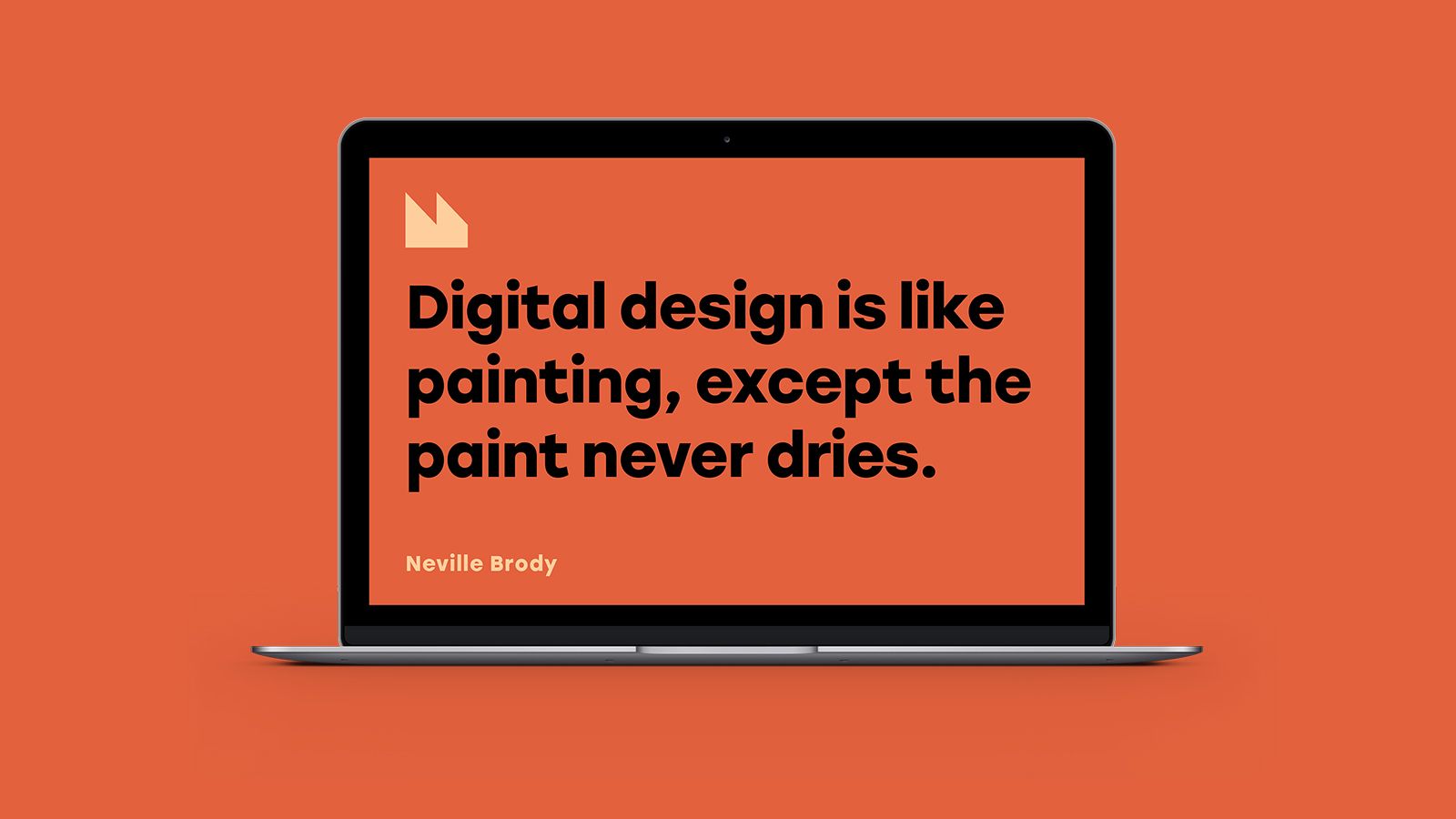 An image of an open laptop containing a quote from Neville Brody.