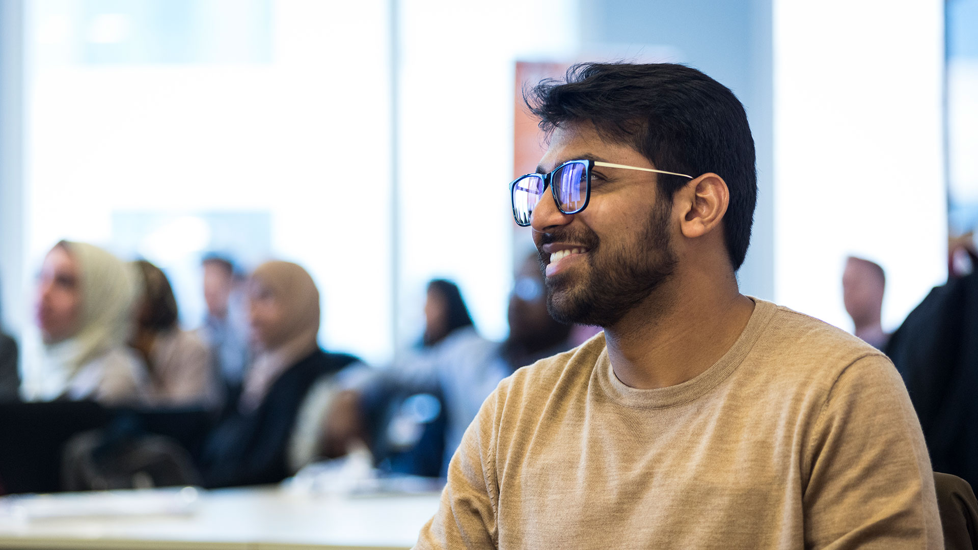 Member of General Medical Council smiling at a workshop