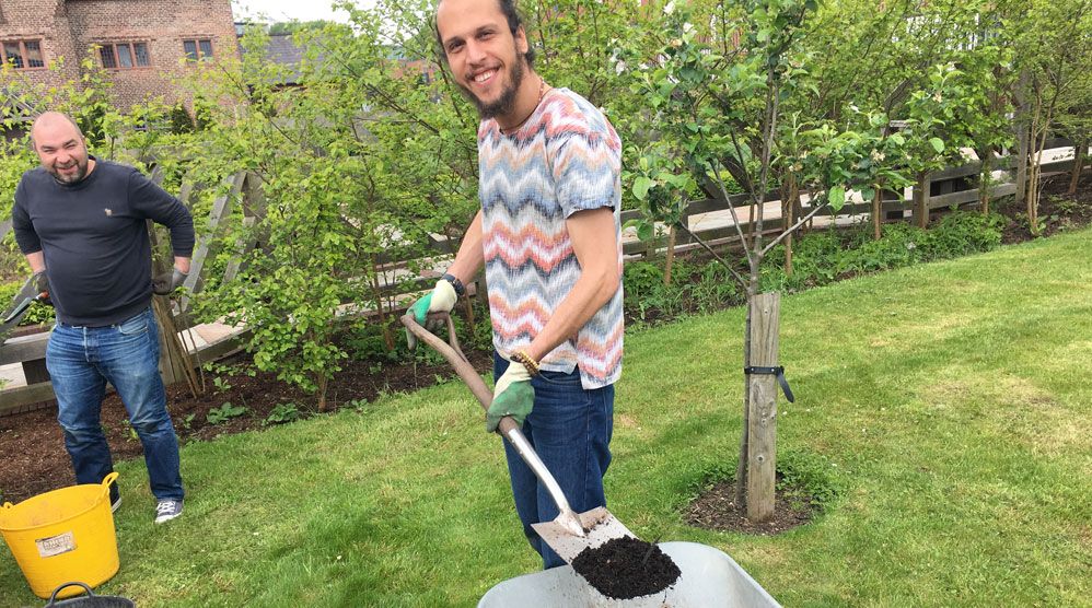 Photo of men gardening