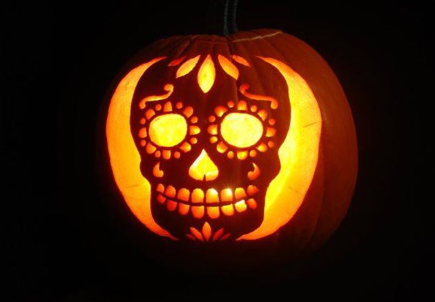 Photograph of Halloween Skull Carved in Glowing Pumpkin