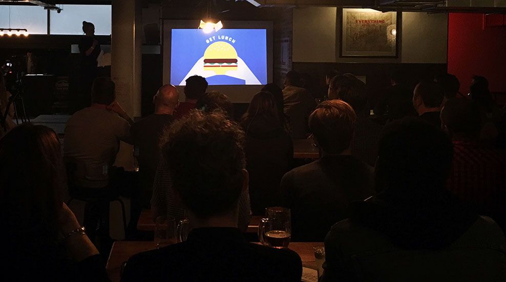 Photograph of darkened stage at Glug event