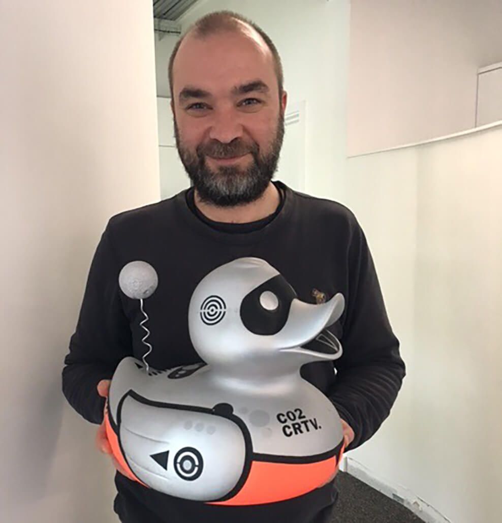 Photograph of Paul holding the Carbon designed duck