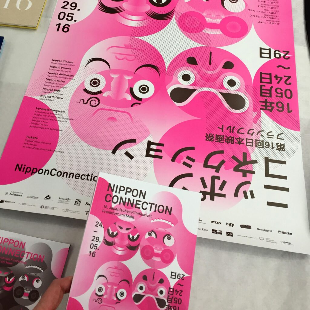 Photograph of book cover and poster