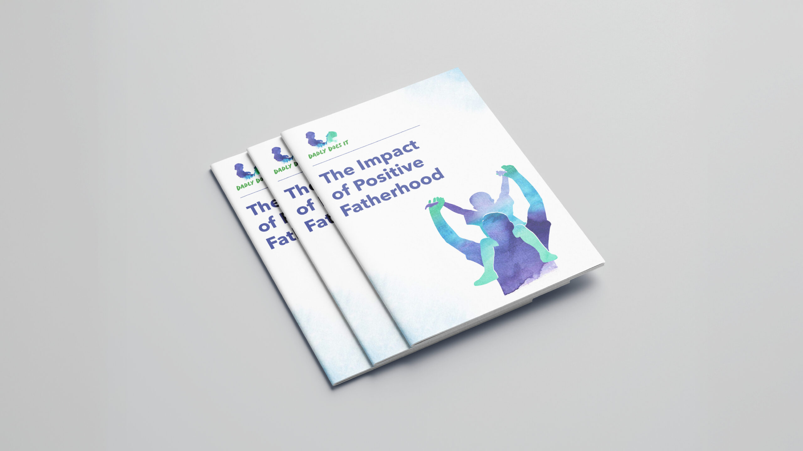 A set of booklets with the title 'The impact of positive fatherhood' written on them.