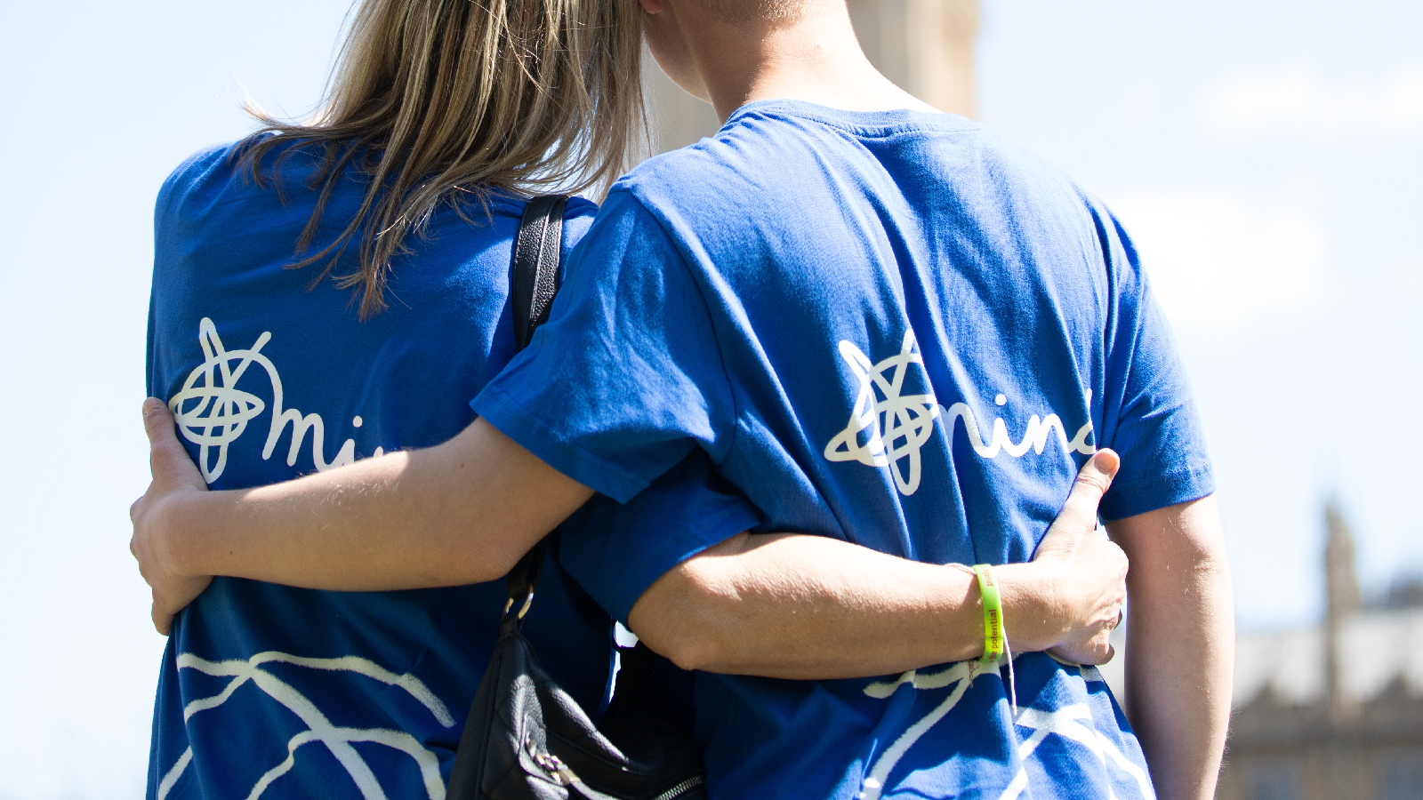 Mind hero image - two volunteers wearing branded tshirts